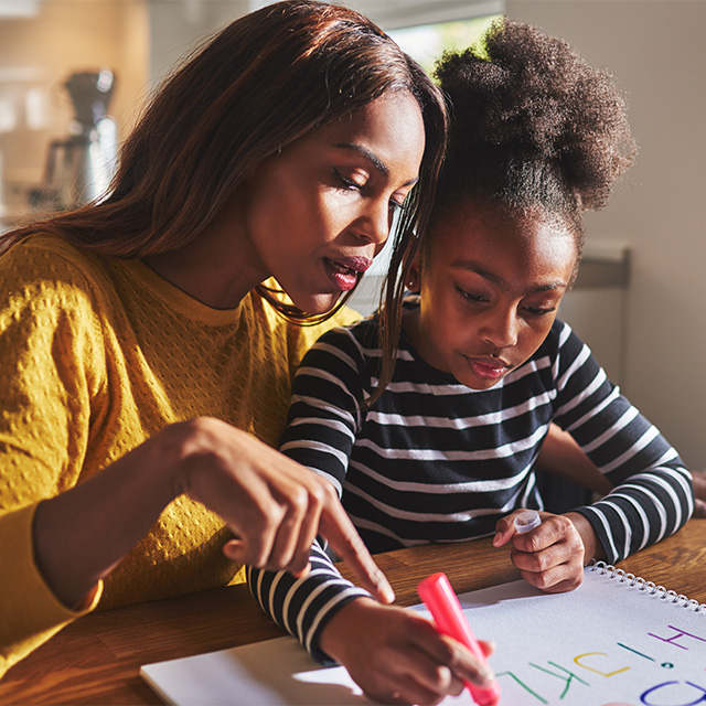 mom helping child with homework