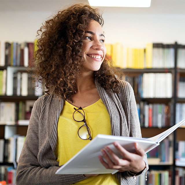 smiling student with book